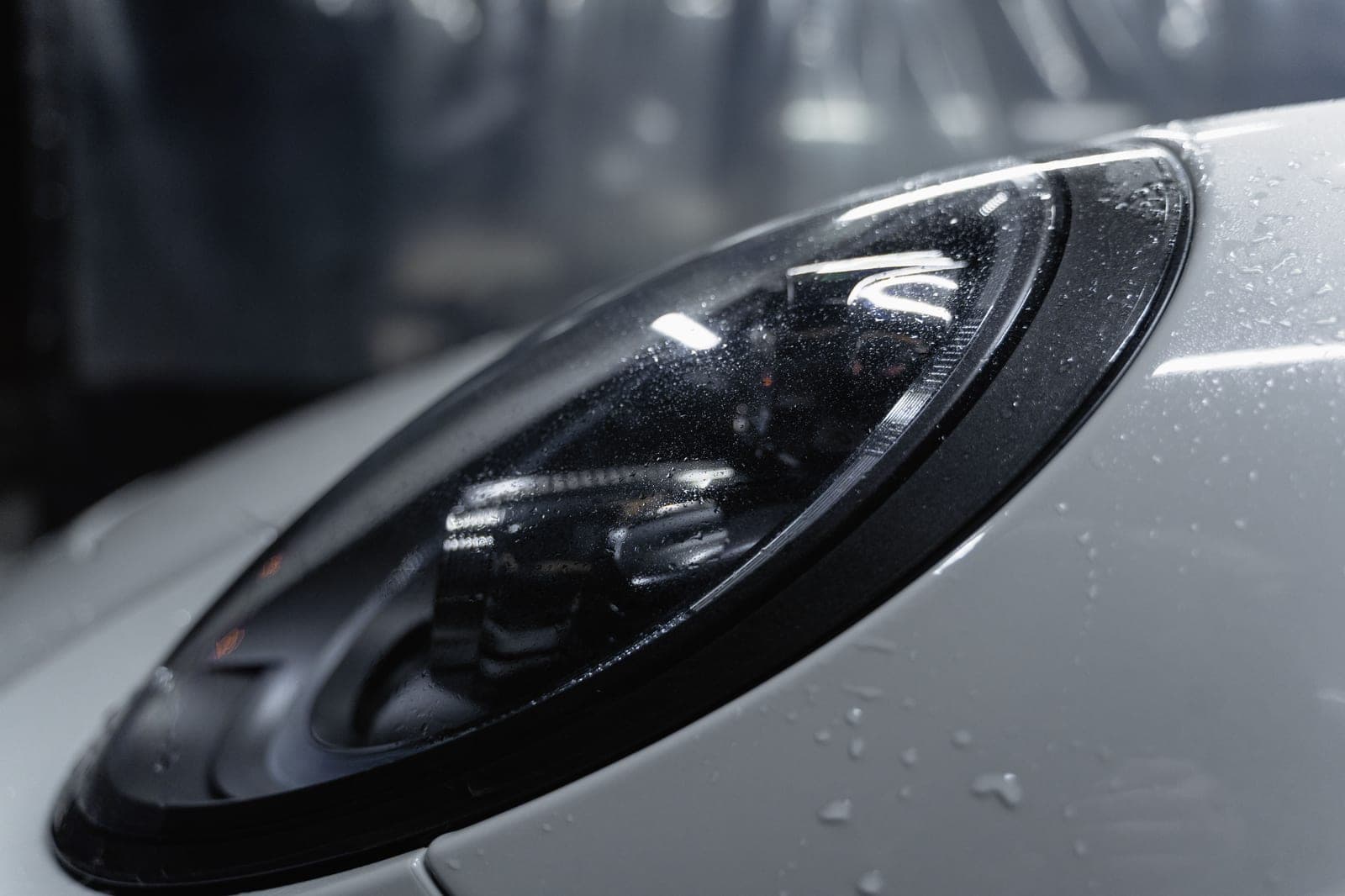 Thick foam and water beading on a freshly washed glossy car panel