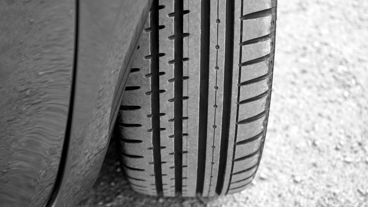 A tire dressing applicator leaving a satin finish on a tire sidewall